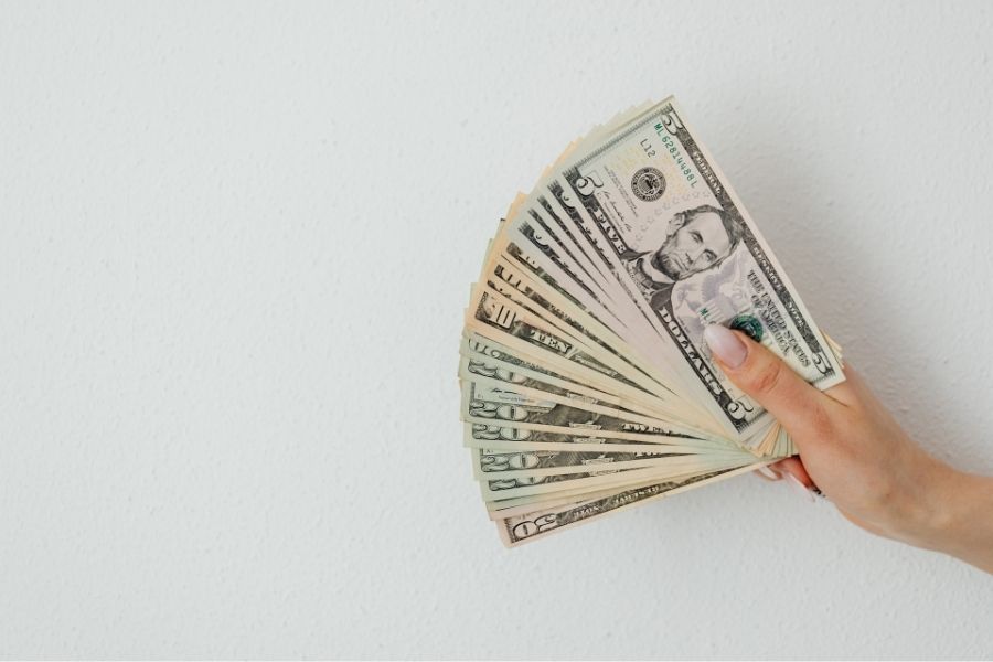 close up shot of person holding paper money