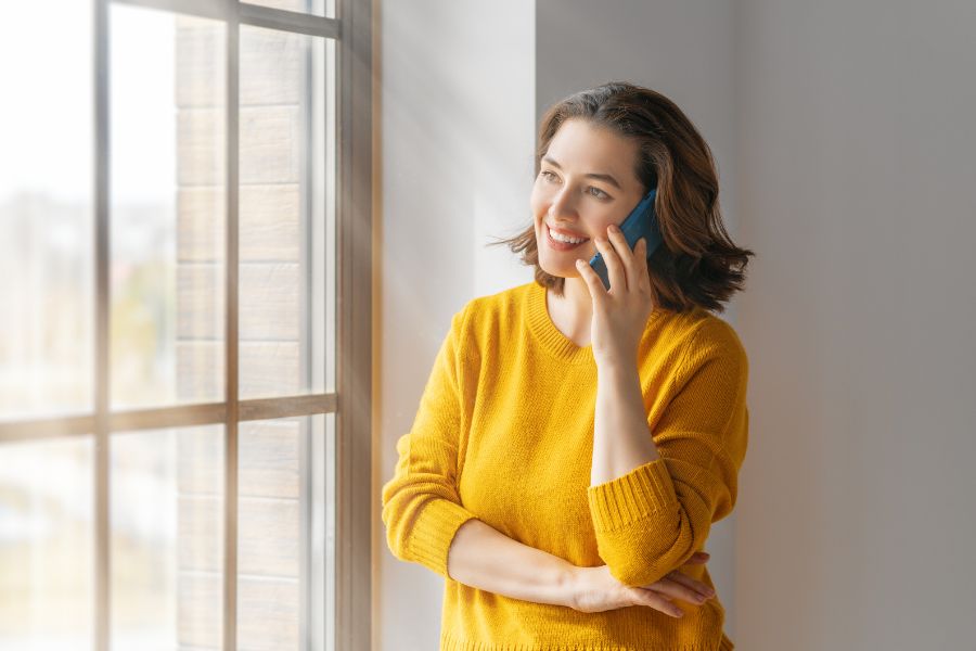 Woman is having conversation by phone