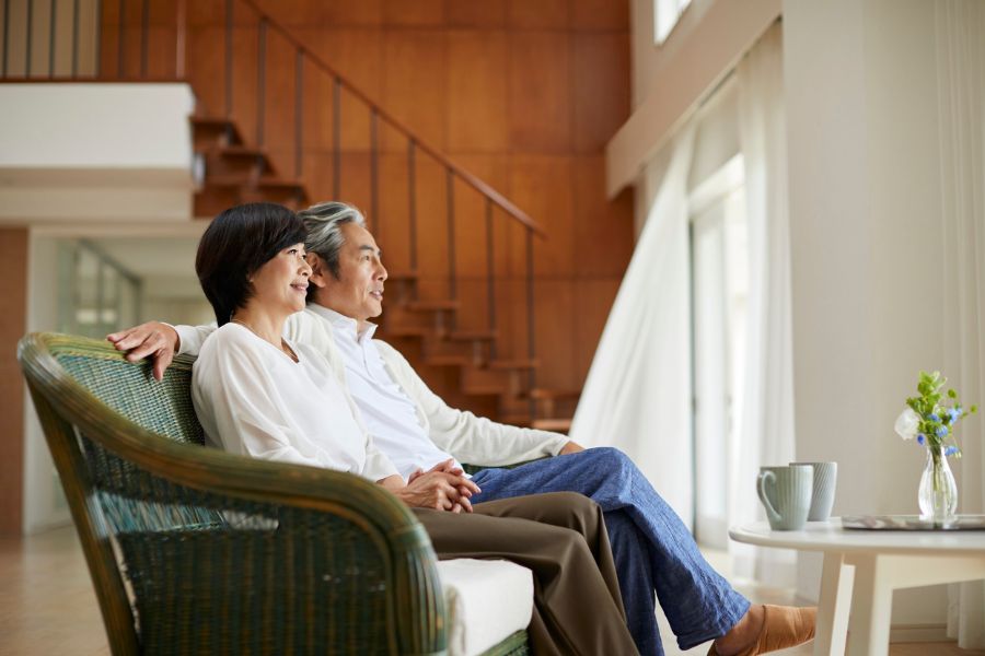 Elderly couple relaxing together at home